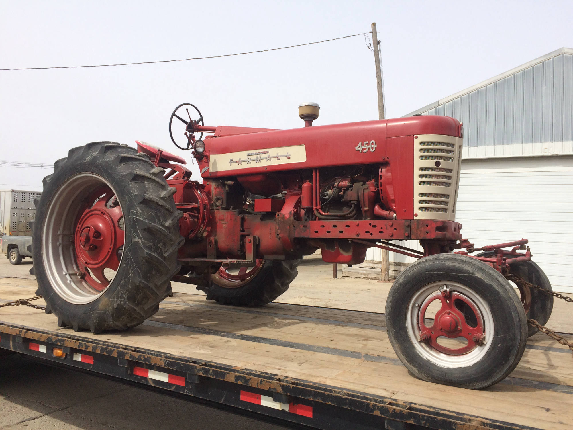 Farmall tractor on transport trailer